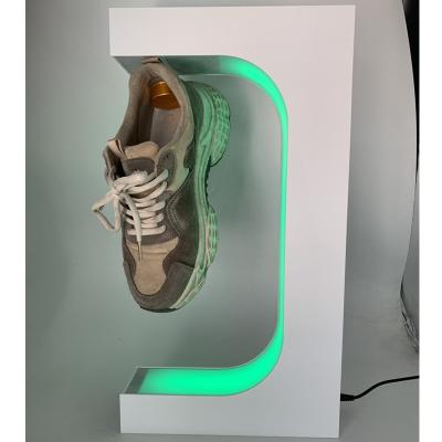 China Custom trade show HOTSALE logo and packaging led light change colorful magnetic levitaion shoes display stand with remote control for sale