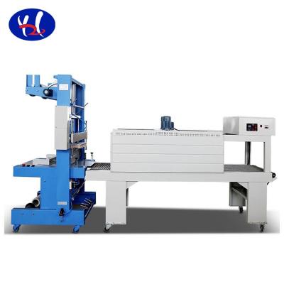 China Food Semi-automatic Mineral Water PET Bottle PE Film Sleeve Shrink Wrapping Machine for sale