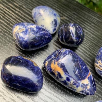 China Europe natural crystal polished dark blue sodalite palm fengshui decoration healing gifts for sale