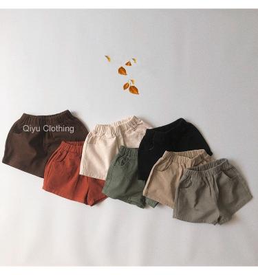 China Anti-Wrinkle Custom Design Boy Shorts 100% Cotton Kids Shorts Blank Solid Boy Girl Black Sports Shorts for sale