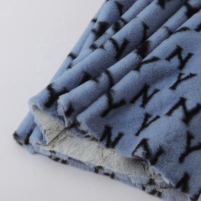 China Tear-resistant 100% Polyester Paint Faux Rabbit Fur Fabric For Toys Bags Coat Slippers for sale