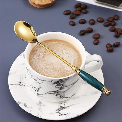 China Viable Ceramic Sugar Spoon Ice Cream Dessert Spoon Handle Stainless Steel Teaspoon for sale