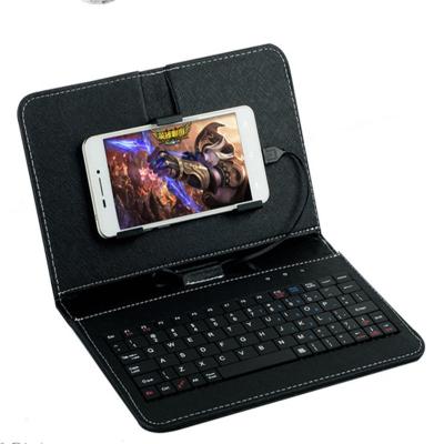 China Plug and Play Cable Keyboard Flip Holster Case Cover 4.8-6.0 Inch Android OTG Protective Universal Mobile Phone Leather Keyboard for sale