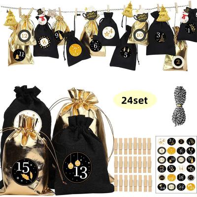 China Eco-Friendly Advent Calendar Bags Black Gold Burlap 24 Days Countdown Drawstring Bags For DIY Christmas Gift for sale