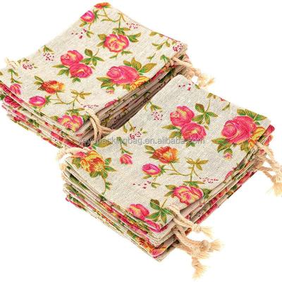 China 12Pack Jewelry Pouch Small Durable Cotton Rose Flower Pattern Printed Drawstring Bag With Tags for sale