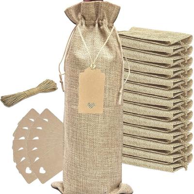 China Durable 12pack Burlap Wine Bags with Empty Labels and Drawstrings Reusable Bottle Covers Bags for Christmas Wedding Holiday Party for sale