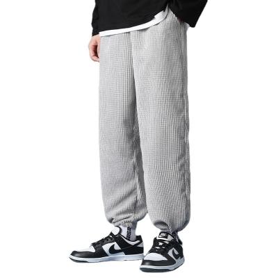 China 2021 autumn Korean fashion solid color anti-static pants men's spotted leg leisure sports student pants for sale