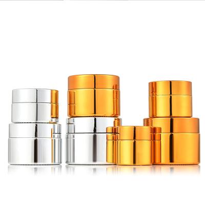 China OEM/ODM Recyclable Gold Empty Cylinder Silver Electroplating UV Cosmetic Glass Cream Jar for sale