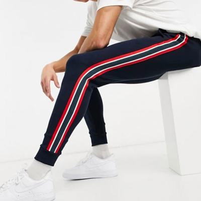 China Streetwear Anti-pilling Side Striped Striped Waist Banding Elastic Men Tapered Sweatpants for sale