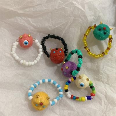 China Fashionable Cute Cute Cartoon Cute Bead Monster Color Candy Color Ins. Elastic String Ring Protect Lucky Ring Gift For Girl for sale