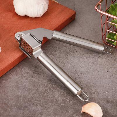 China Viable Kitchen Accessories Garlic Press Stainless Steel Tools Fruit Vegetable Success Amazon Manual Garlic Press for sale