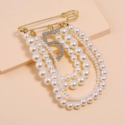 China Pearl Tassel Korean All-match Style Brooch Fashion Diamond Snap Number 5 Brooch for sale