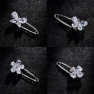 China Korean version of flower simple zircon large plum pin bowknot anti-glare brooch pin for sale