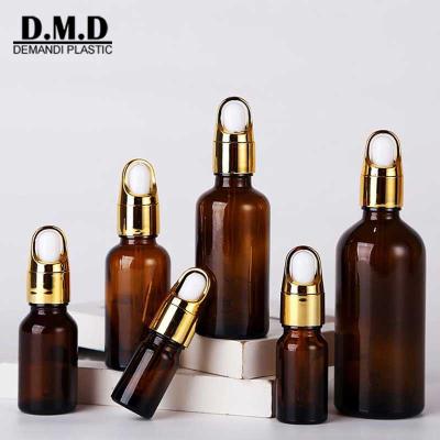 China Personal Care Cylinder 5ml 10ml 15ml 20ml 30ml 1oz 50ml 100ml Empty Brown Cuticle Oil Nitriles Glass Amber Essential Dropper Bottle With Lid for sale