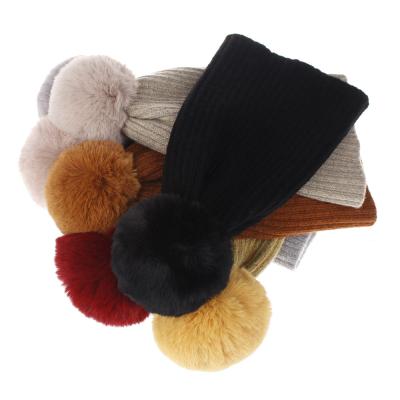 China COMMON Cloth Wool Beanie Hats With Fur Pom For Women Winter Fashion Jacquard Knitted Hat Women for sale