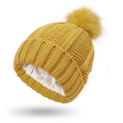 China JOINT logo winter custom warm pom pom knitted slouchy satin striped beanie for adult for sale