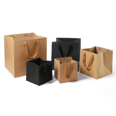 China Recyclable Custom Square Paper Bag Brown Bottom Black Paper Bag Logo Baking Cake Gift Flower With Handle for sale