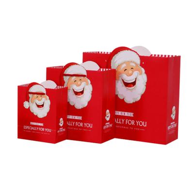 China Custom Recyclable Christmas Logo Paper Gift Bag Recyclable Paper Bag For Christmas Gift Wrapping for sale