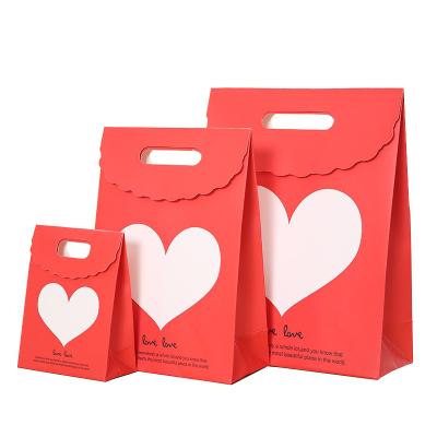 China Recyclable Stand Up Handle Shopping Die Cut Paper Bag With Fin Lamination Customized Paper Bags for sale