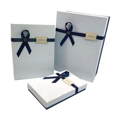 China Custom Logo Recyclable Wholesale Luxury Wedding Gift Box With Blue Bowknot Stiff Fancy Paper Gift Box for sale