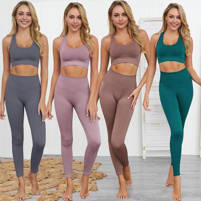 China Breathable Ladies Gym Set Workout Apparel Women Set Solid Natural Color Seamless Yoga Set Gym Bra And Seamless Activewear Loose Legging for sale