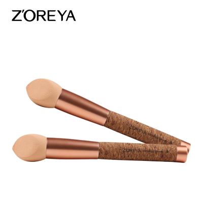 China Angular Blush Unique Design Cork Handle Rose Gold Oval Sponge Makeup Brush for sale