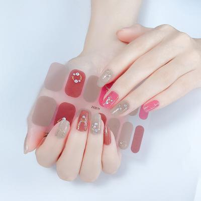 China Easy Apply and Remove Luxury Nail Stickers Nail Strips with Logo Popular Laser Nail Famous Sticker for sale