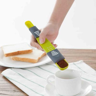 China Sustainable Wholesale Multi-Function Kitchen Bake Tools Double Head Moving Scale Single Plastic Adjustable Doser Tools for sale