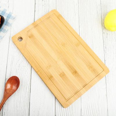 China Viable Useful Bulk Bamboo Simplicity Defrosting Board Cutting Board with Juice Groove for sale