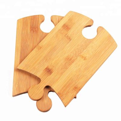 China Chopper Shape Puzzle Shape Innovation Craft Viable Unique Bamboo Cutting Board for sale