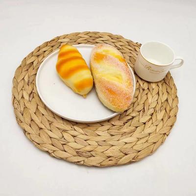 China Handmade Natural Round Rope Woven Place Mat Eco-Friendly Straw Dining Table Mat Rattan Water Hyacinth for sale