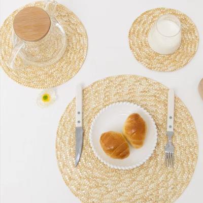 China Fashionable Natural Round Oval Braided Straw Woven Placemats Cup Tableware Mats Table Dish Mats for sale