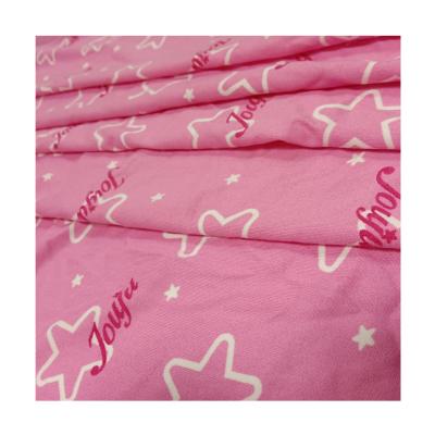 China Soft Stretch Hand Feeling DBP Pink Color Star Printed Double Brushed Polyester Fabric for sale