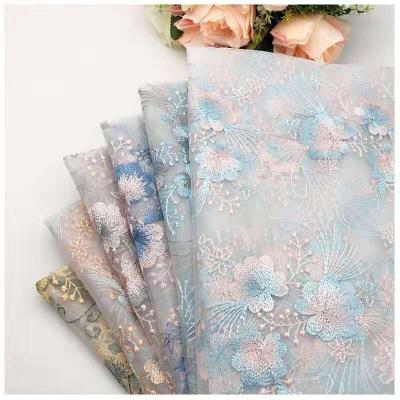 China Breathable net embroidery fabric double flower embroidery fabric spring wedding and summer dress fabric for sale