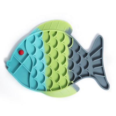 China Viable Anxiety Relief Fish Shape Slow Feeder Silicone Pet Licking Mat With Strong Suction Back Cups for sale