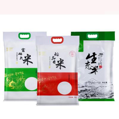 China Hot Sale China Supplier Moisture Proof Manufacturers Customized 5 Kg Plastic 10 Kg Clear Window Vacuum Rice Packing Bag With Handle for sale