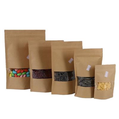 China Custom logo food doypack zipper brown kraft paper food packaging resealable paper bags with clear window for sale