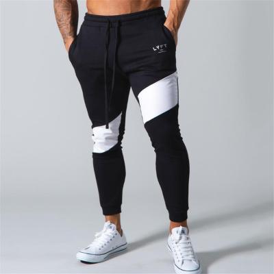 China Anti-wrinkle China factory fashion polyester byxor newspaper stretch gym jogger pants mens formal sweat suit for sale