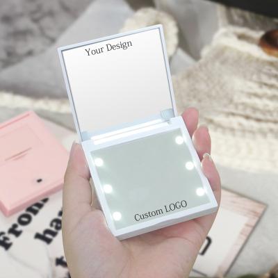 China Selfie Pocket Mini Make Up Magic Vanity Lighted Makeup Led Mirror Small Size Compact Mirror With Light for sale