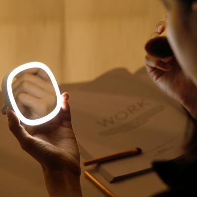 China Magnifying Touch Screen Make Up LED Mirror Cosmetic Folding Portable Compact Pocket LED Lighted Makeup Mirror for sale