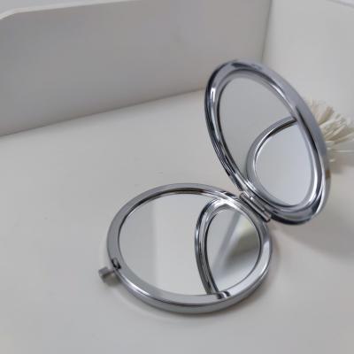 China High Quality 2X Magnifying Slim Circle Iron Hand Held For Lady Mini Mirror Makeup for sale