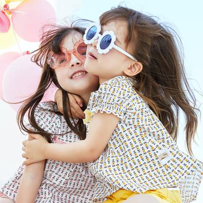 China New Arrival Fashion Cute Sunflower Oval Soft Glass Girls Multi Color Baby Kids Sunglasses for sale