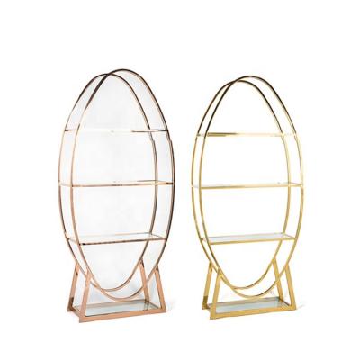 China Living Room Oval Cabinet Gold Frame Stainless Steel Party Wine Stands Wine Glass Display Cabinet for sale