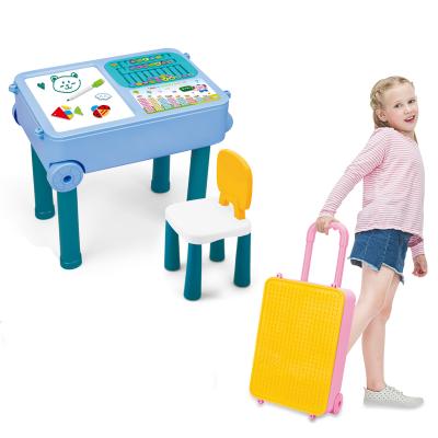 China Construction Toy Building Blocks Learn Desk Writing Board Luggage Toys Suitcase Kids Block Table for sale