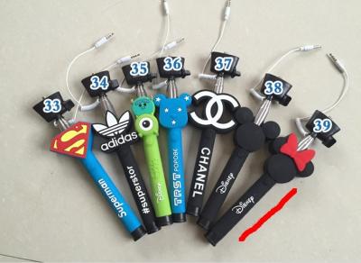 China promotional gift customized silicone cartoon selfie stick with cable for sale