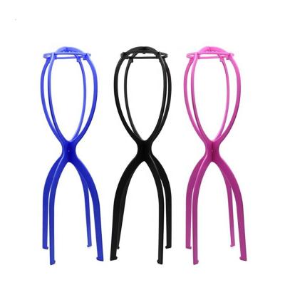 China Custom colorful plastic wig stand display stand plastic tripod, wholesale pink tall cheap stand wig stand for sale