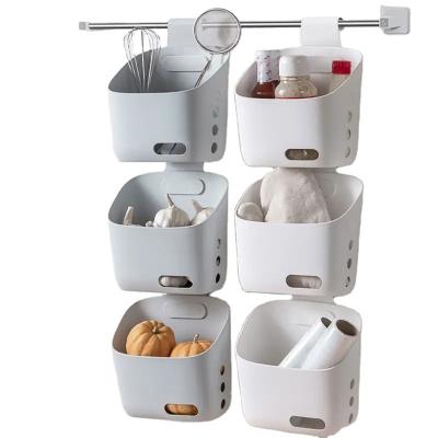 China Viable Multi-layer Hanging Storage Box Basket Bathroom Hanging Small Basket Ginger Garlic Plastic Kitchen Wall Mounted Storage Basket for sale