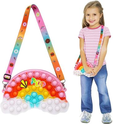 China Environmental Rainbow Clouds Noise Shoulder Bag Stirs Noise Sensory Backpack Silicone Toy Purse Jumping Bag for sale