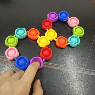 China New Environmental Wearable Noise Push Bubble Push Finger Finger Press Silicone Wristband Sensory Toy for Kids for sale