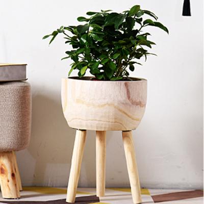 China Pastoral Wholesale Wooden Flower Pots Planter Pot With Wooden Legs For Garden Decor for sale